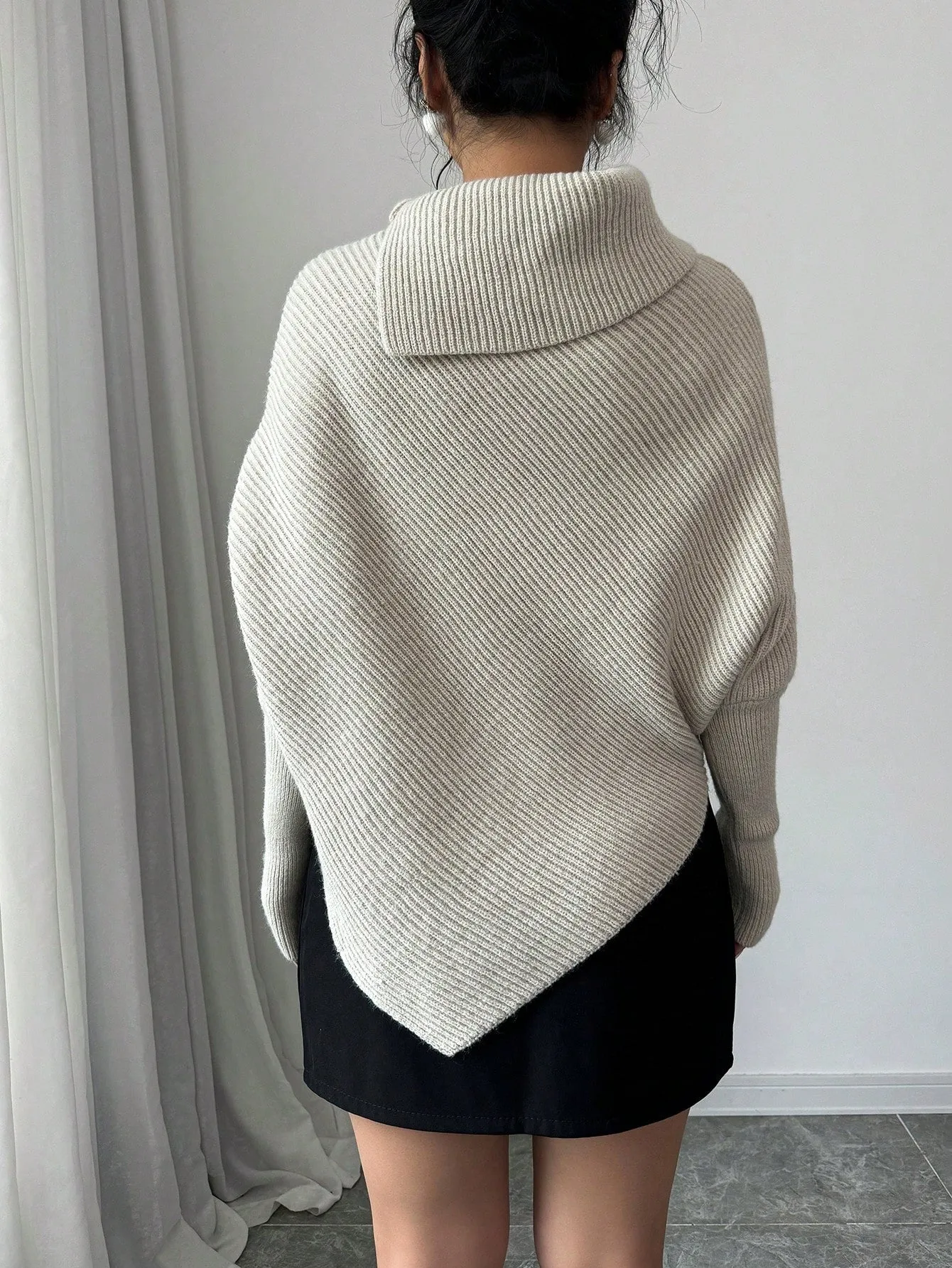 Elegante Top de Punto con Manga de Murciélago en