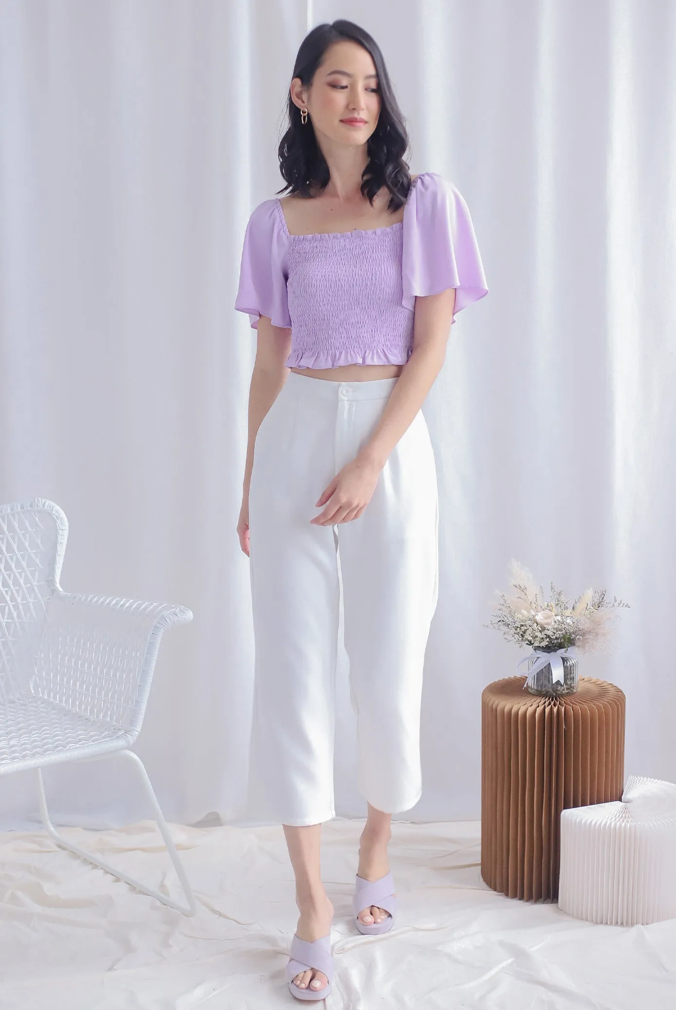 Stephi Flutter Sleeve Smocked Top In Lilac