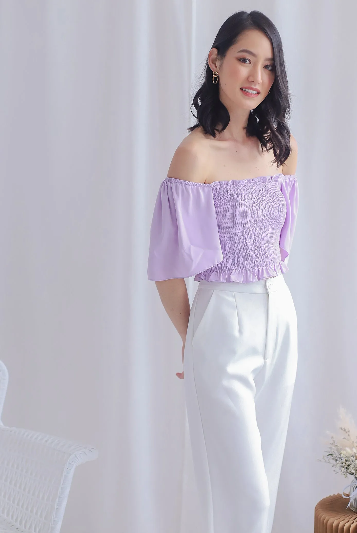 Stephi Flutter Sleeve Smocked Top In Lilac